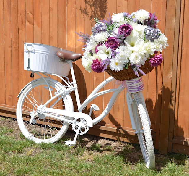 White bike deals with flowers