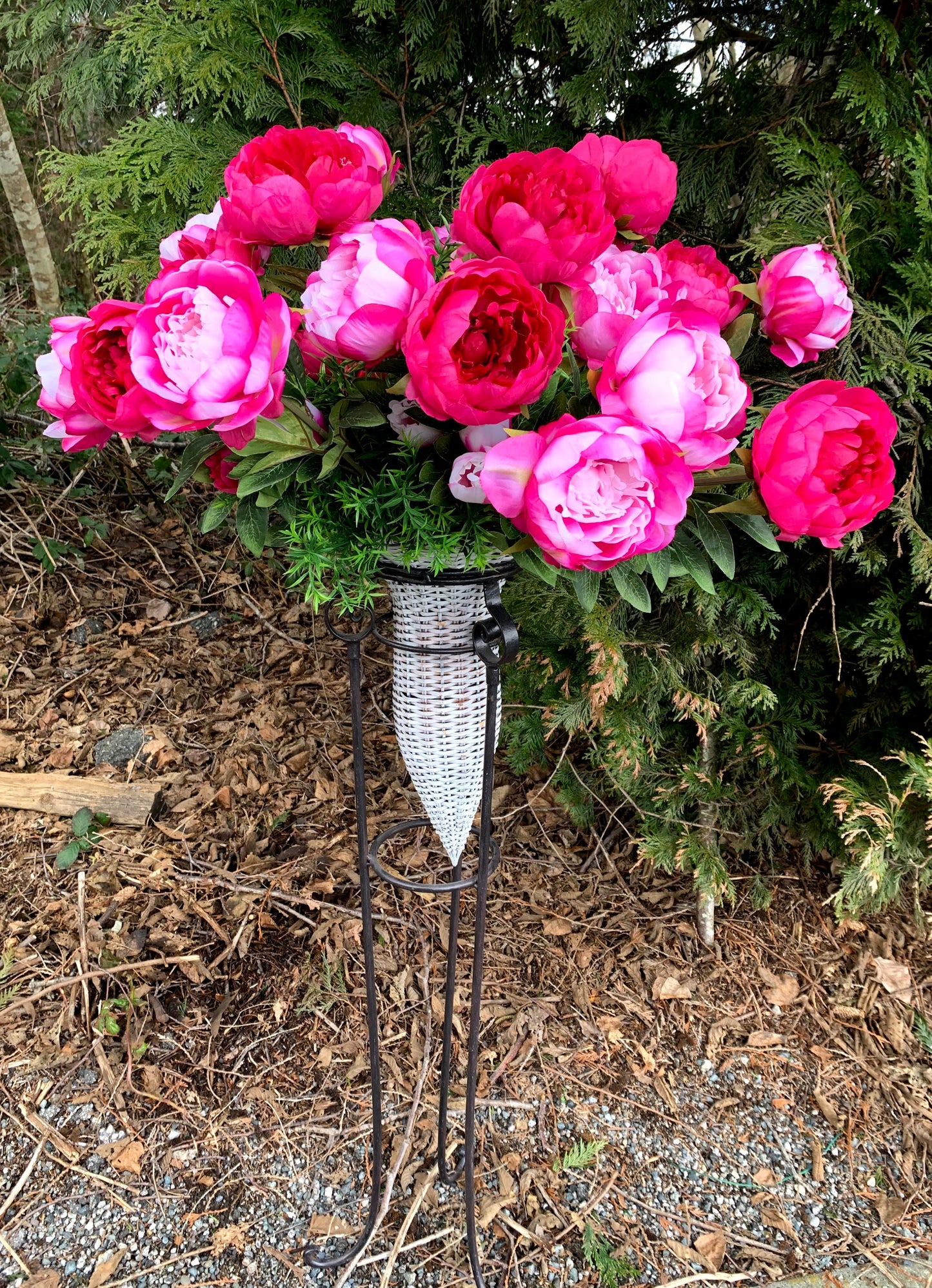Cerise Peonies in a Wicker Cone Stand