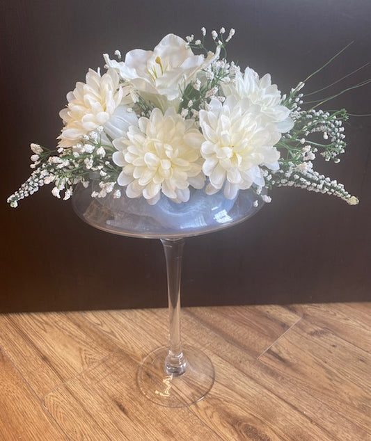 Glass flower arrangement with dusty blue sash in side