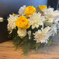 Flower basket with yellow and white flowers